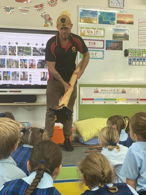 Hunter Barnes educating in a school