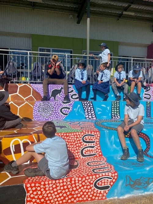 Hunter Barnes educating in a school