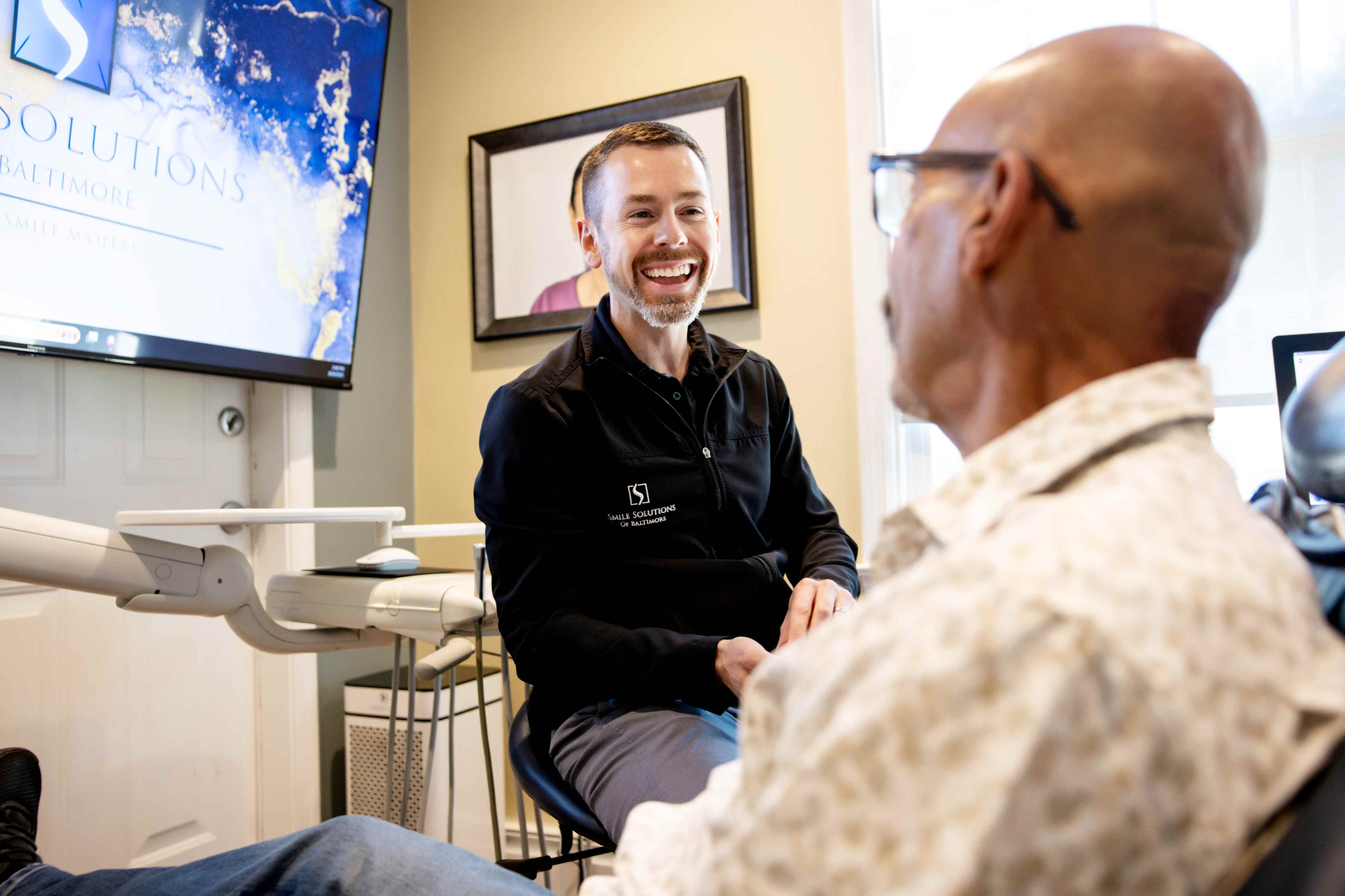 Our dental specialist at Smile Solutions of Baltimore, explaining the details of same-day crowns