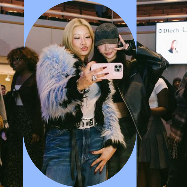 Yoon Ahn takes a selfie with a student after the Fireside Chat, in front of a screen showing the DTech Lab event slide.
