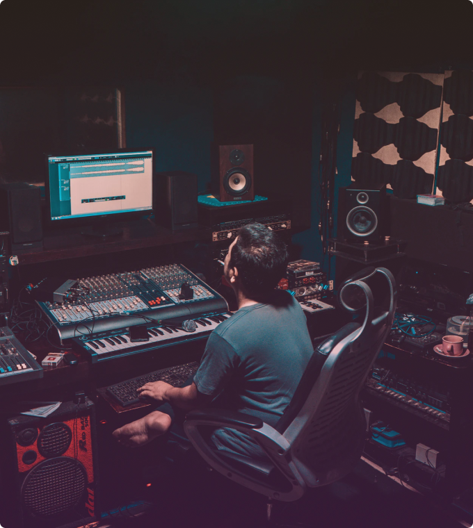 man is sitting in the recording studio