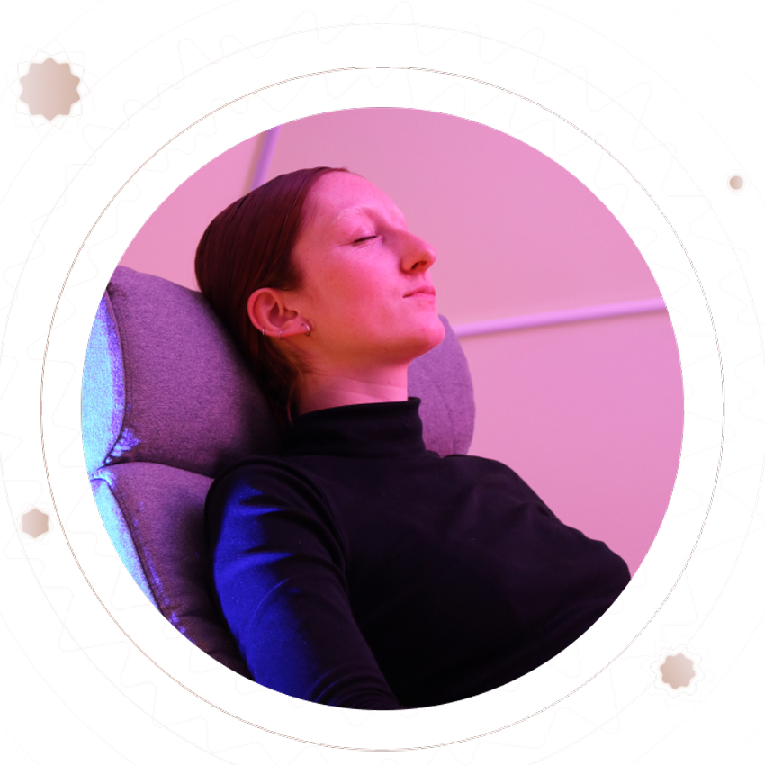 young woman is lying on the chair with closed eyes