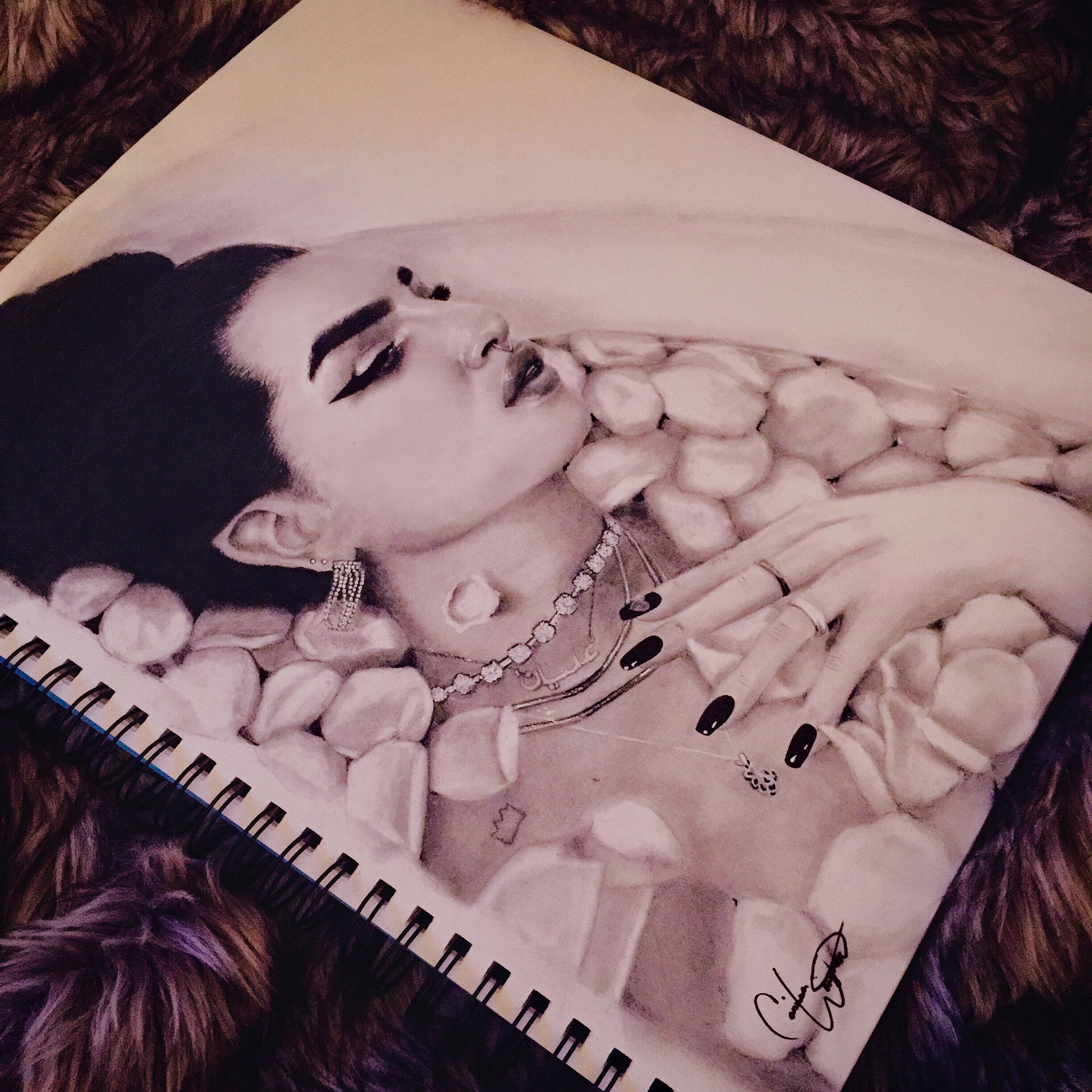 pencil drawing of a woman in a bathtub covered with rose petals