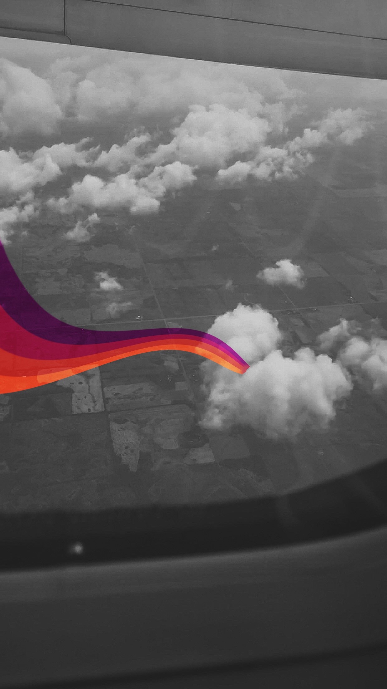 Photo of a heart shaped cloud seen from an airplane window. A stream of red orange and purple lines are drawn from the middle of the cloud to the edge of the picture. 