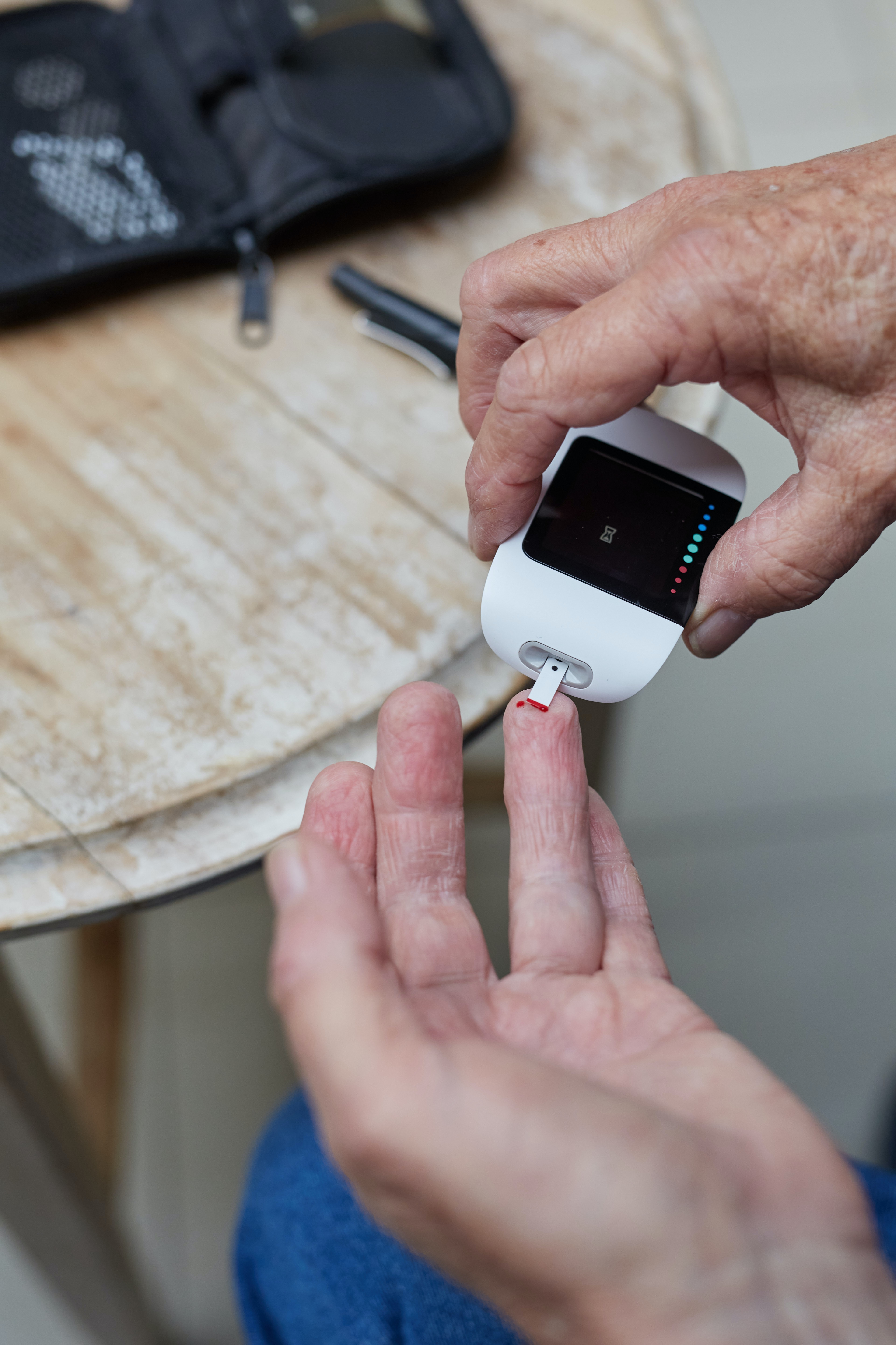 Image of a diabetic taking a blood glucose reading