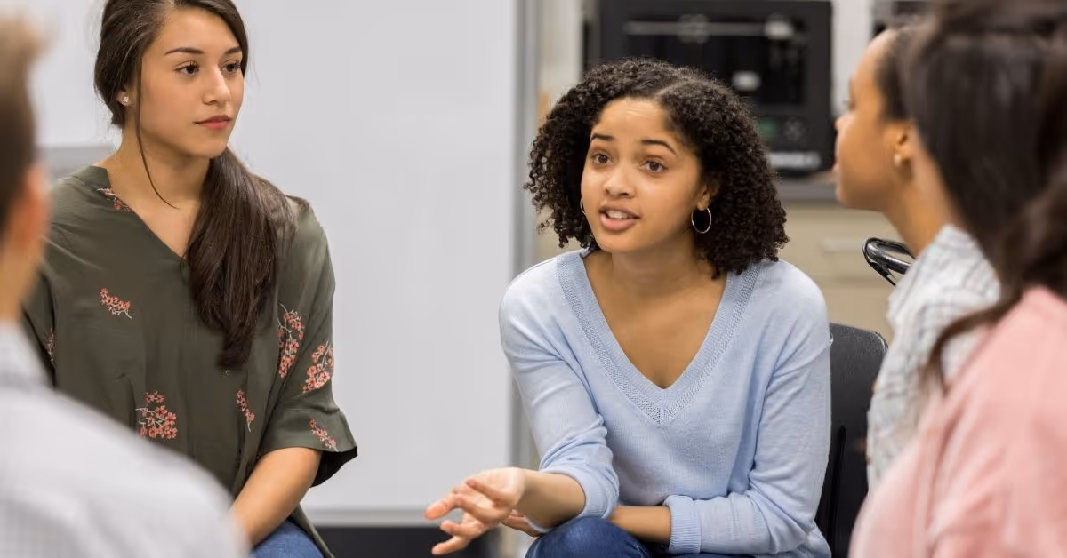 A group of young students communicating