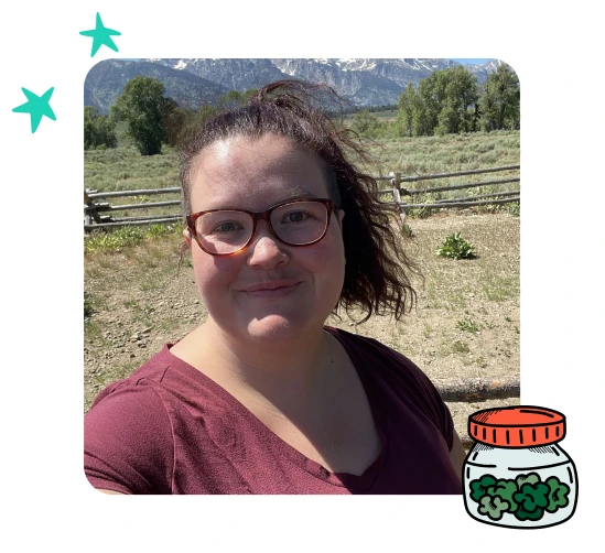 A photo of Gabrielle Hilley outside with mountain in the background.