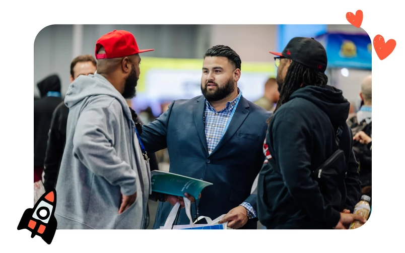 Attendee networking with exhibitors at MJBizCon while exploring cannabis industry innovations on the show floor.