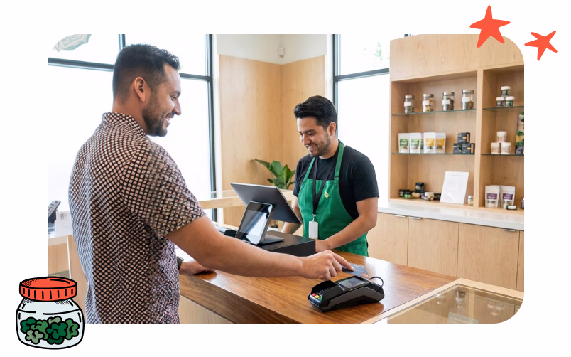 A smiling dispensary customer is tapping his credit card to pay for his new cannabis purchase.