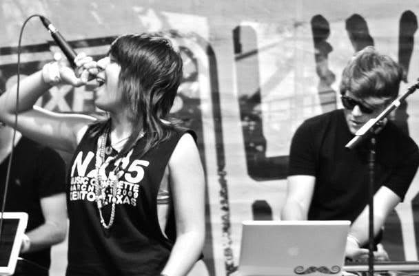 Natasha Brito performing live at Six Flags during her early career as a pop-electronica artist in the MySpace era, before transitioning into creative direction and brand strategy