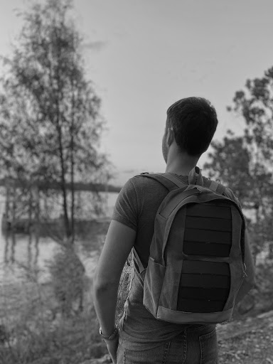 Man wearing solar panel backpack 