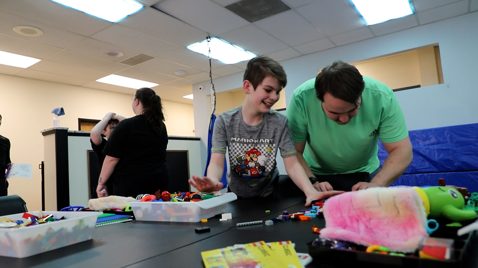 Participants taking part in a Lego activity in NAC's Skills and Recreation Program