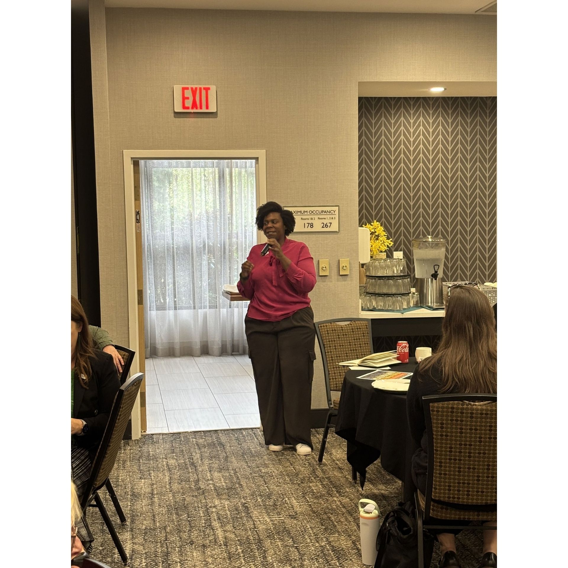 Rep Jamila Taylor speaks into microphone