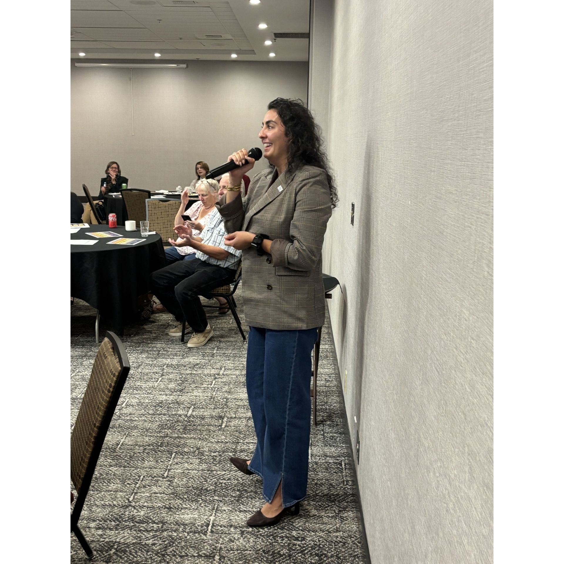 Rep Darya Farivar speaks into microphone