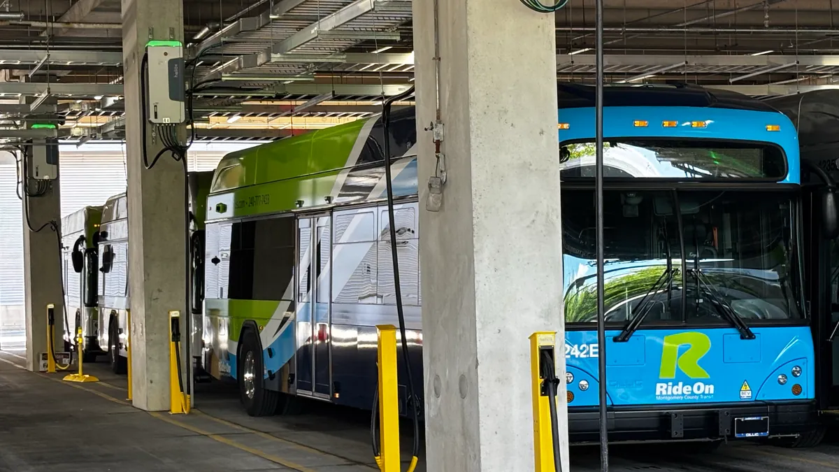 Electric buses charging at a Heliox-equipped depot in Montgomery County, MD