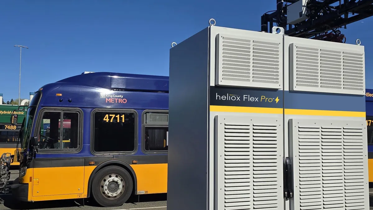 Heliox Flex Pro charger next to an electric bus at a Seattle transit depot