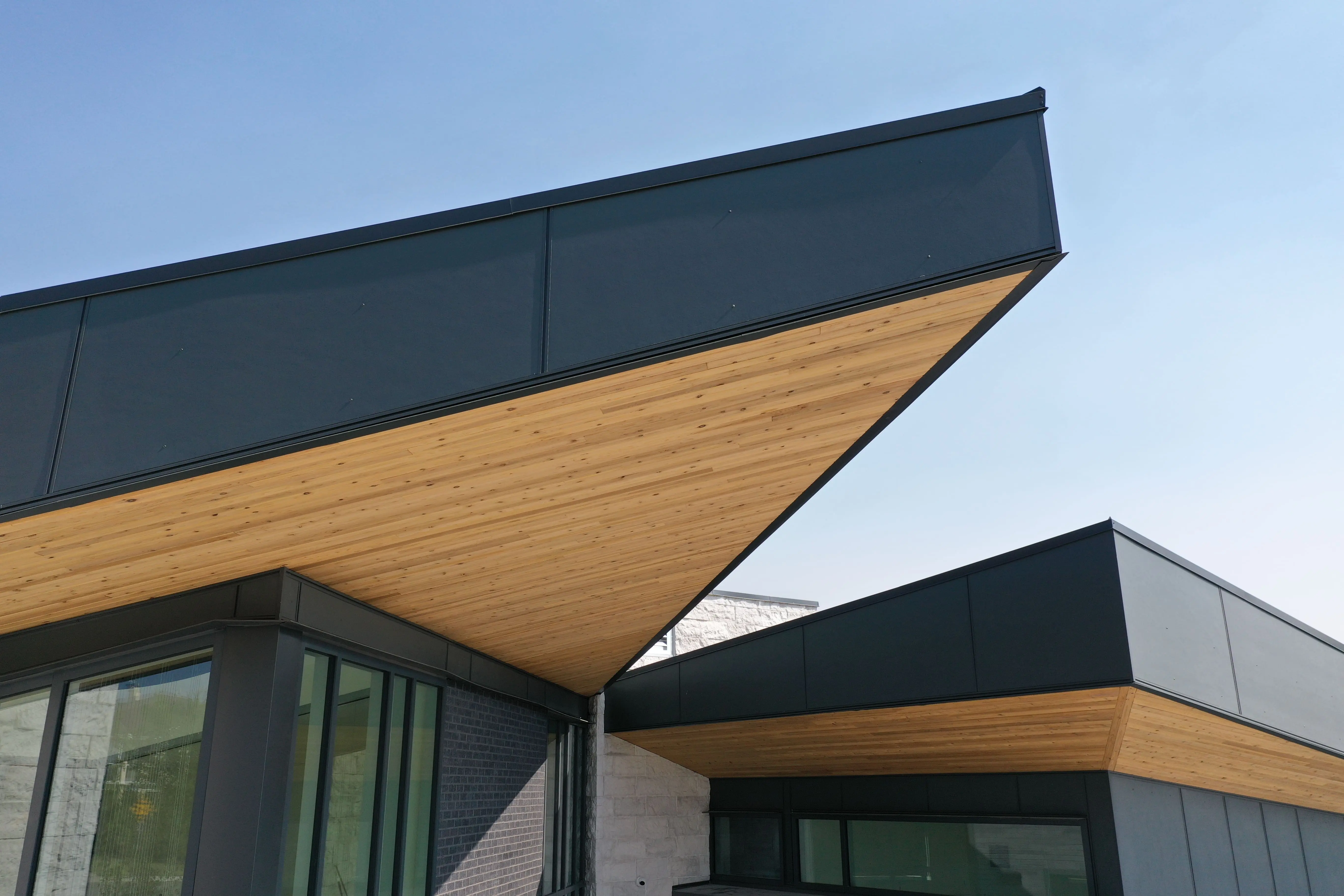 Modern home with cedar soffits and black metal fascia.