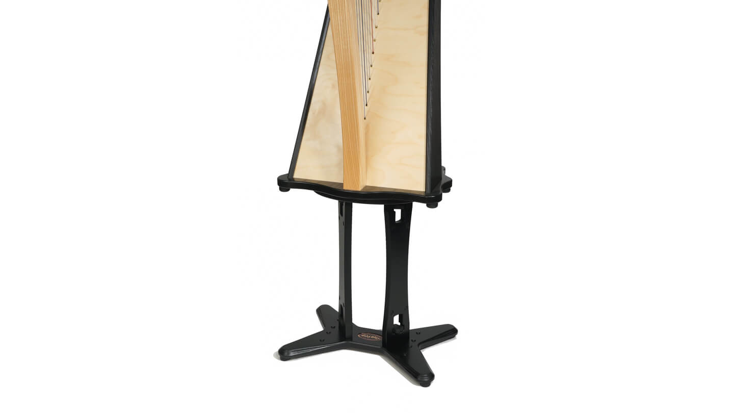 Harp attached to a black wooden stand with x-shaped foot and two tall legs