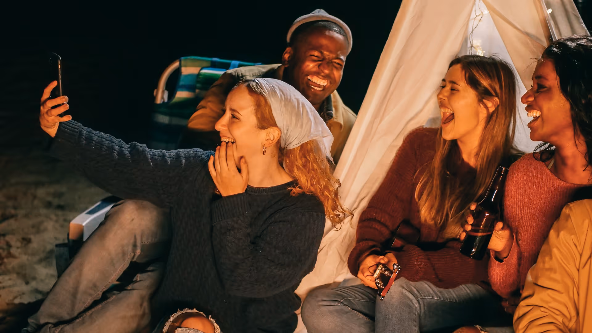 camping on the beach with friends