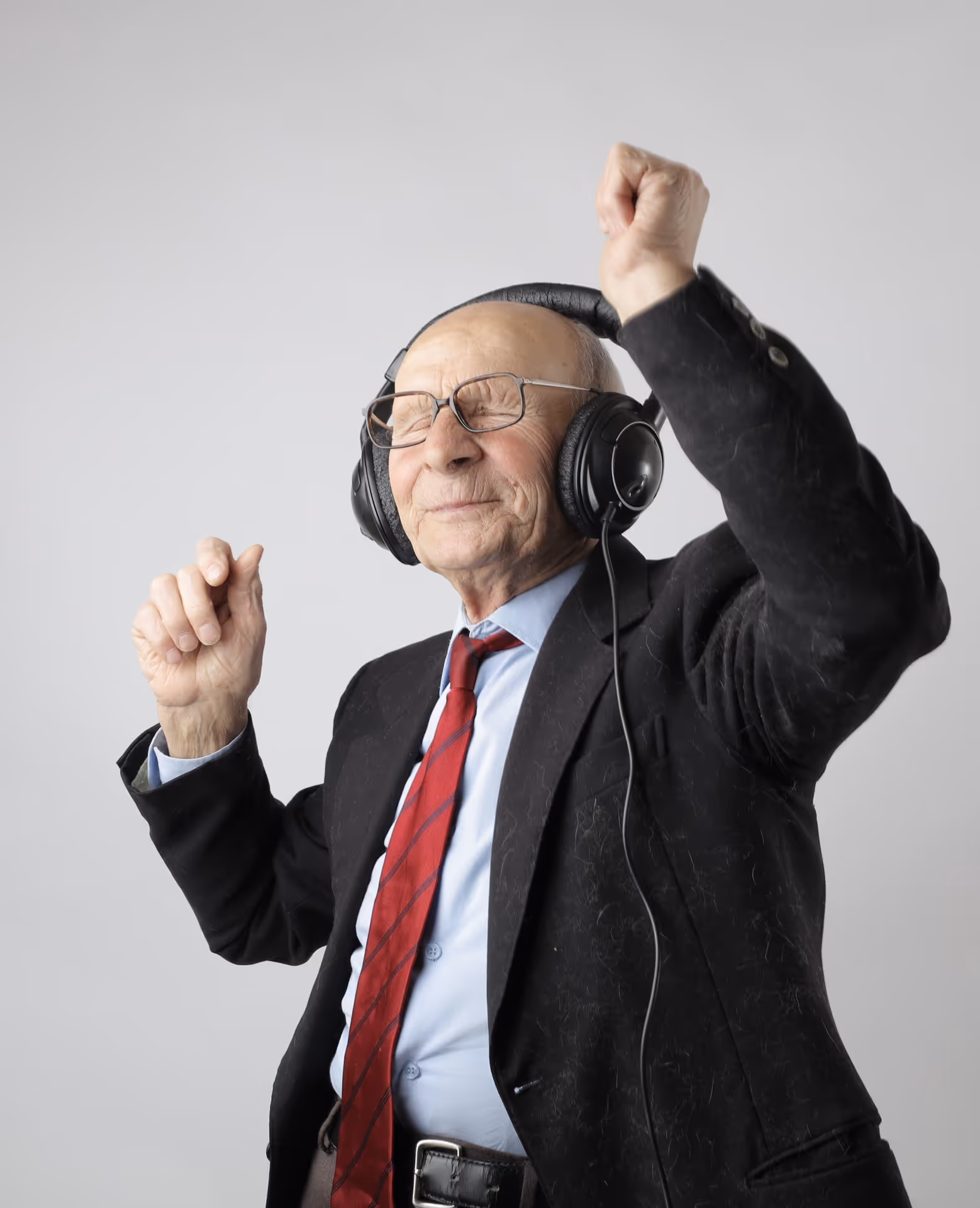 Elderly man listening to music on headhones