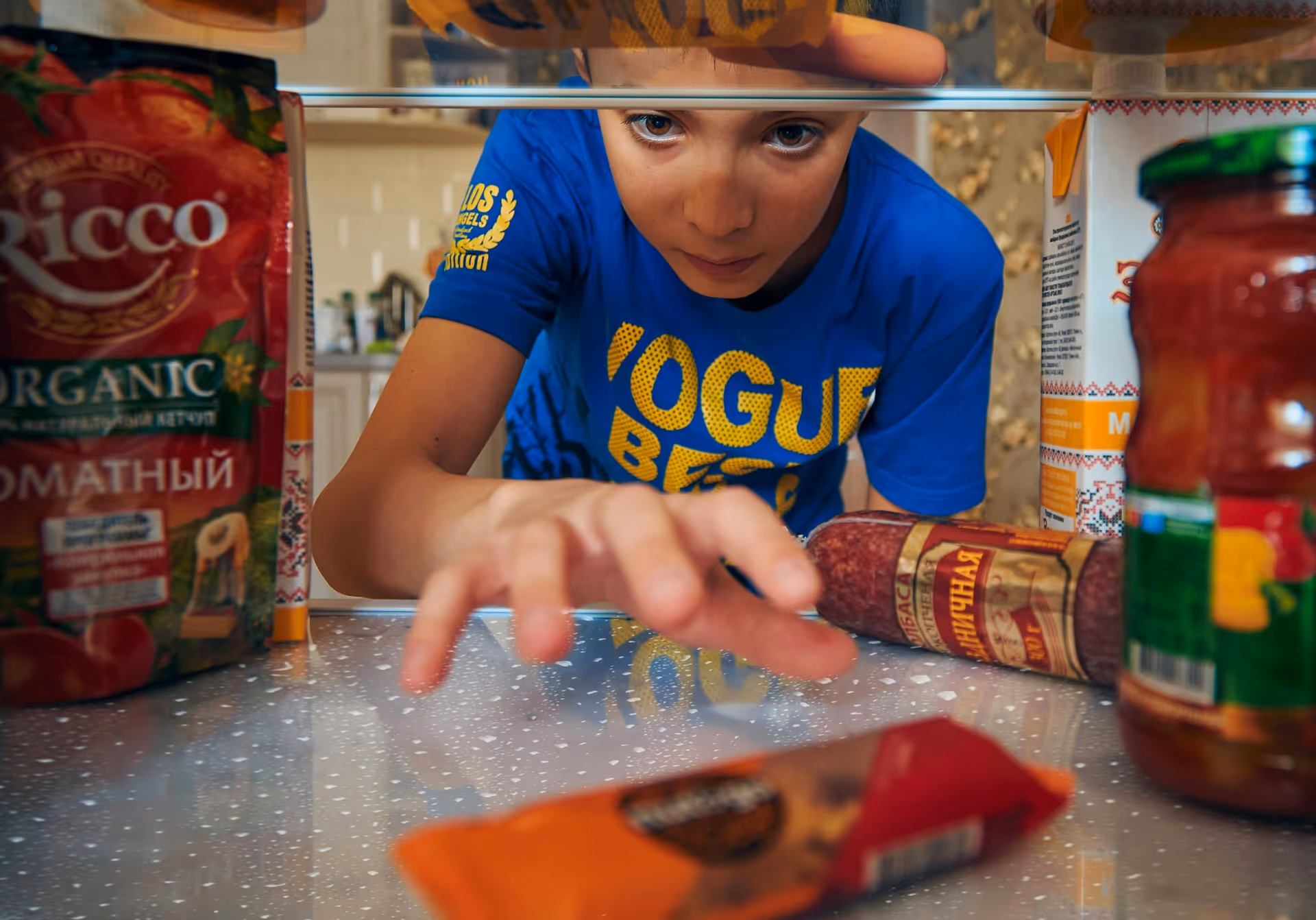 Boy reaching out for a candy bar