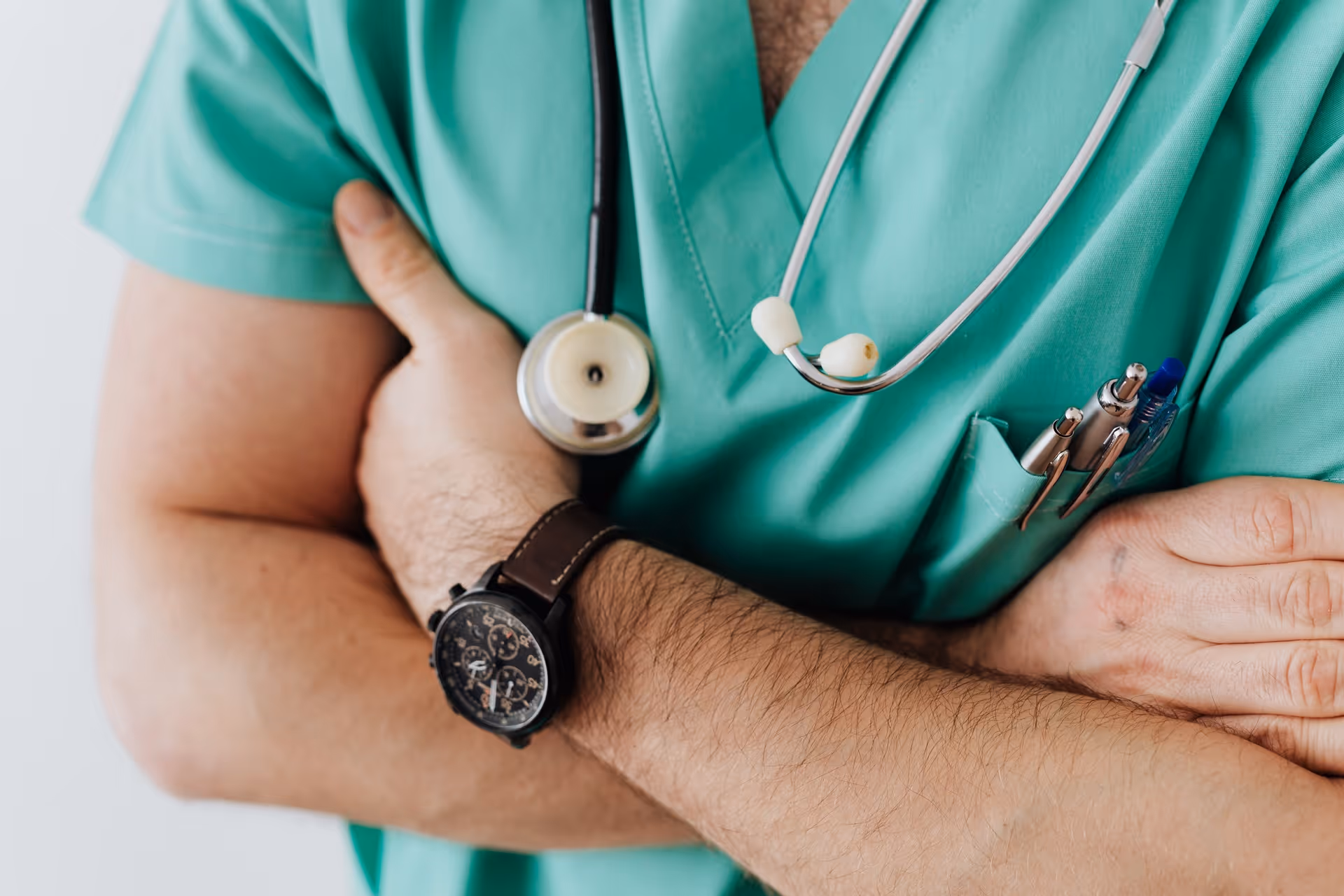 headless medical doctor with crossed arms and stethoscope