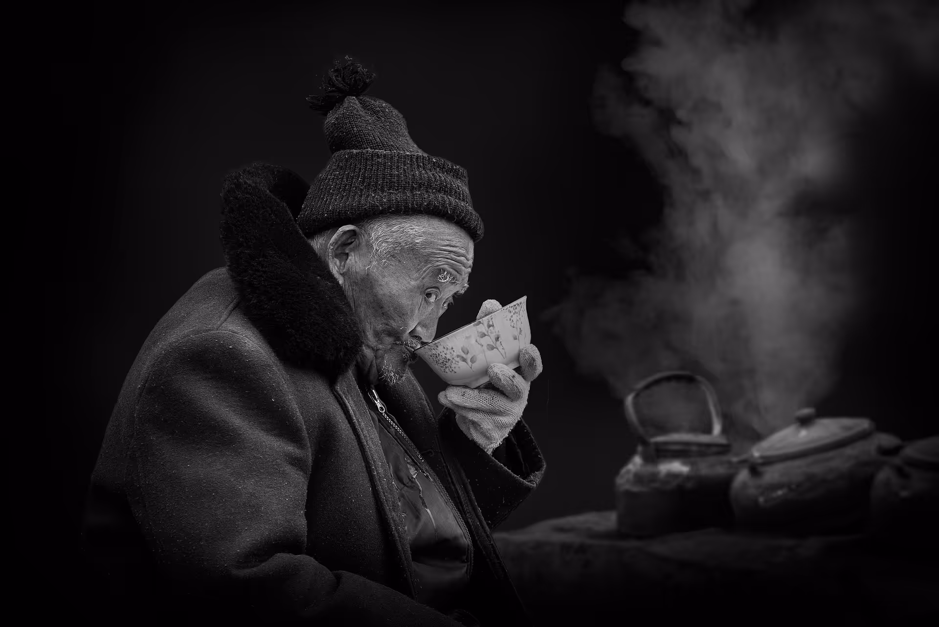 Elderly Asian man drinking tea