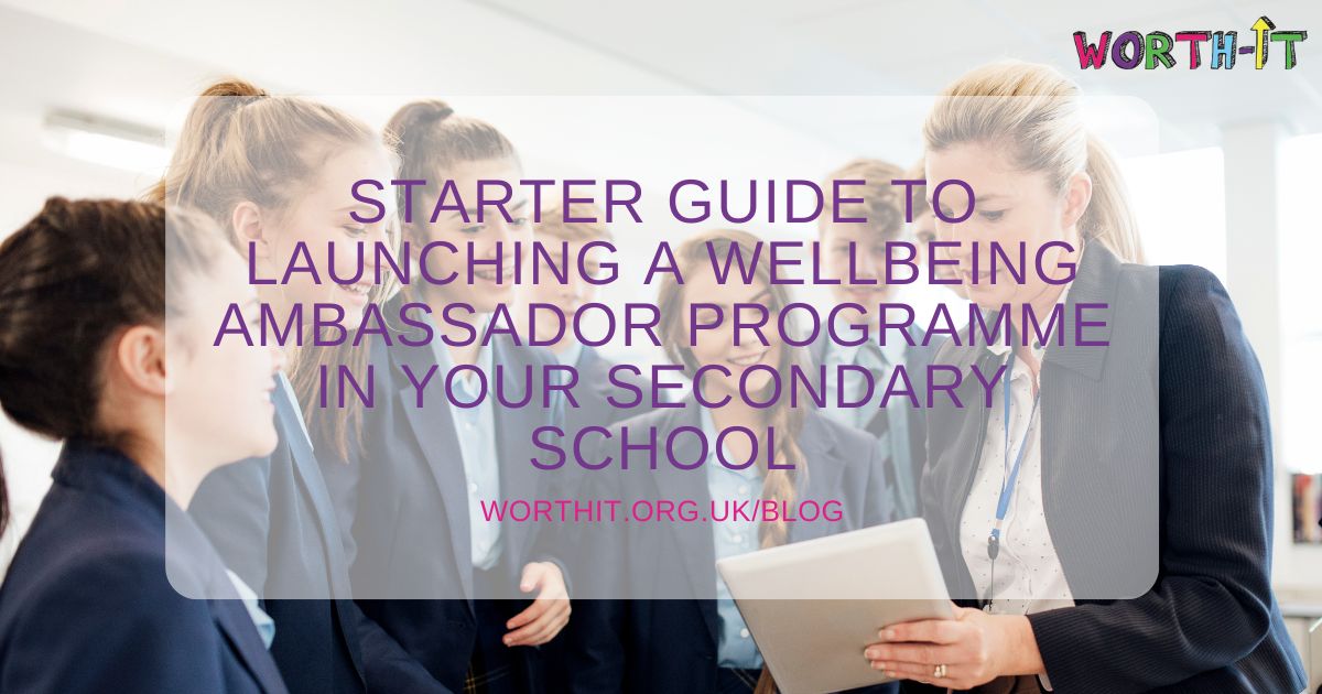 Group of secondary school students working with teacher in a classroom