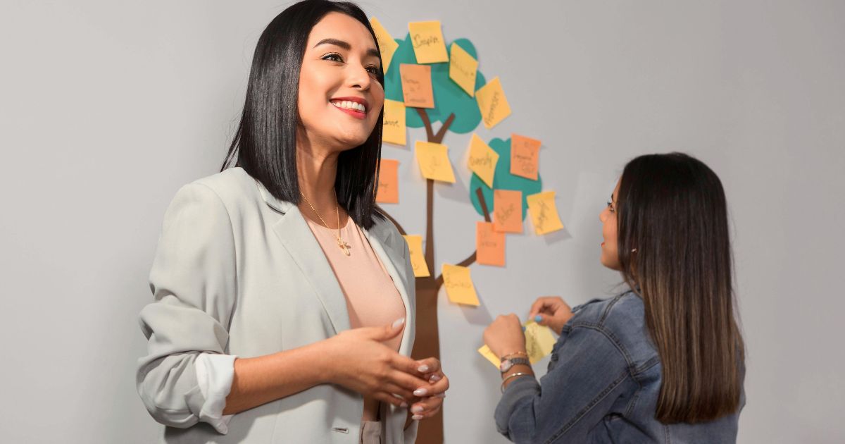 teacher with a student doing a wellbeing activity using a tree