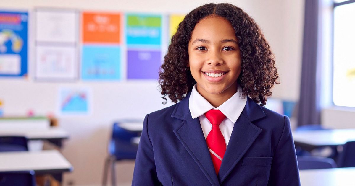 Female student in a secondary school looking happy