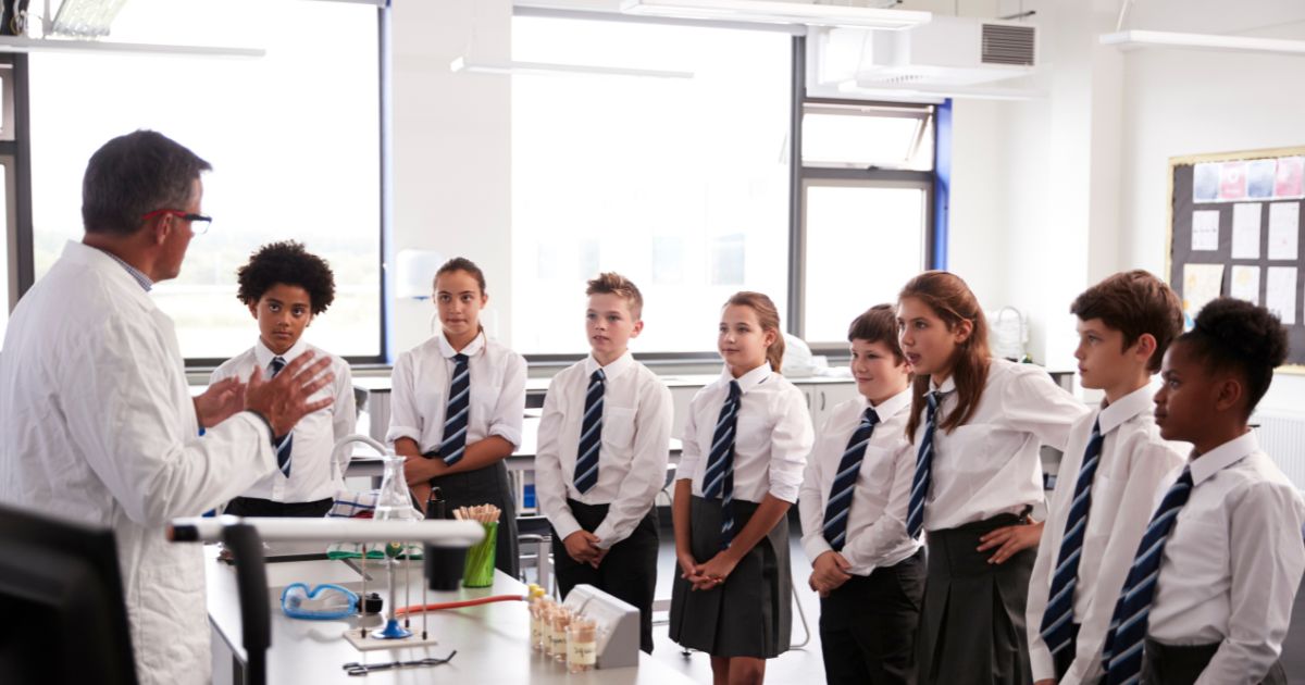 Group of secondary school students engaged in a science lesson