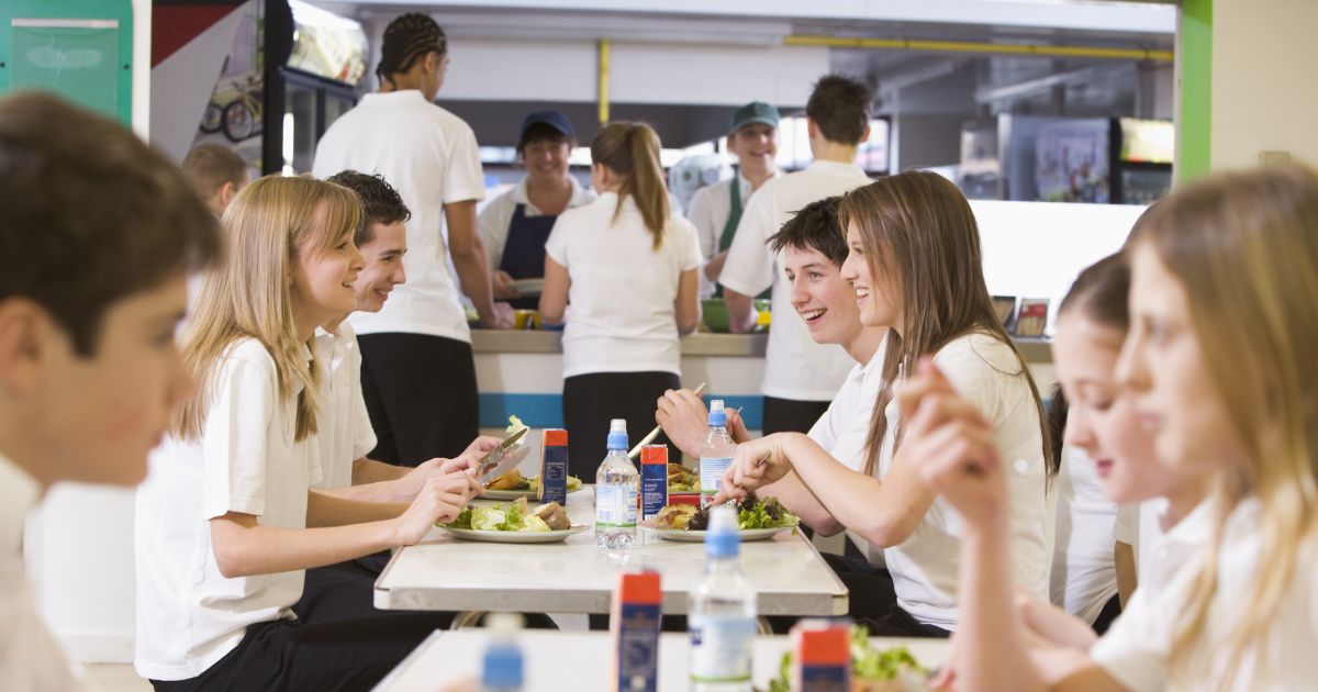 Inclusive group of students in a secondary school canteen