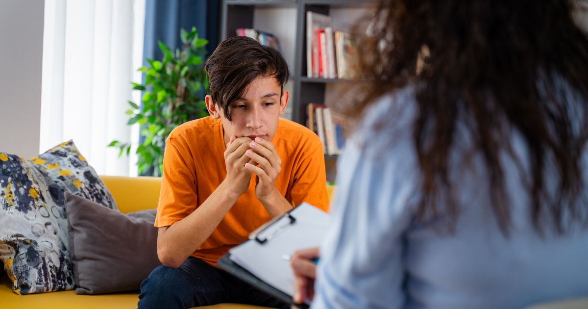 Teenage boy working with a life coach