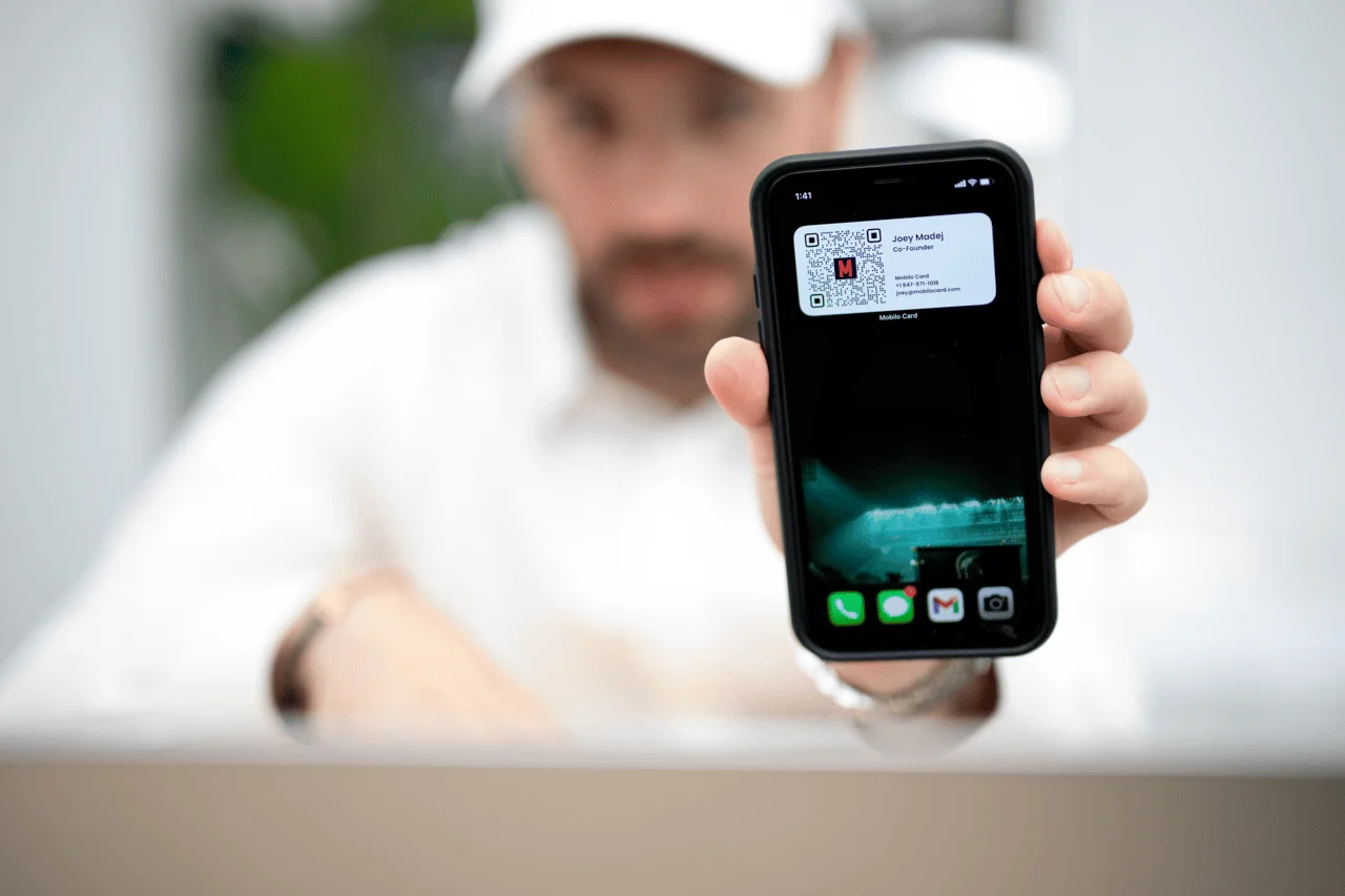 Mobile scren showing a contact widget with  QR code and contact details
