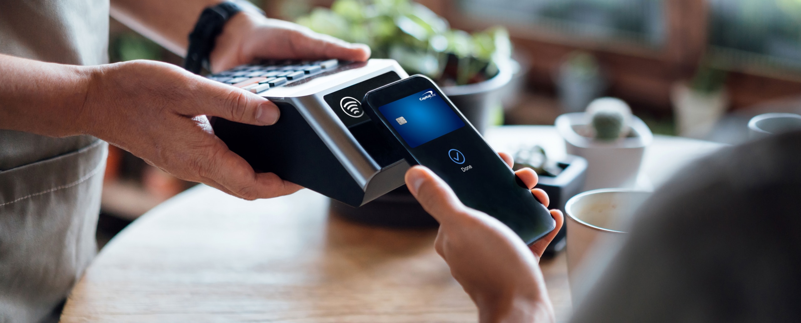 man paying with phone - QR Code Alternatives