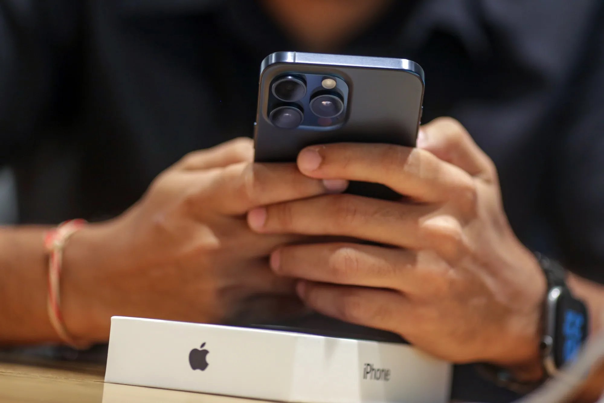 man holding an iphone - How to Create a Digital Business Card on iPhone