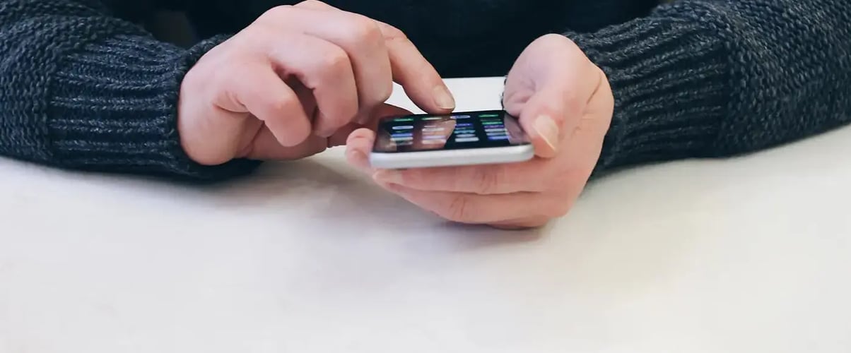 man using an iphone - How to Create a Digital Business Card on iPhone