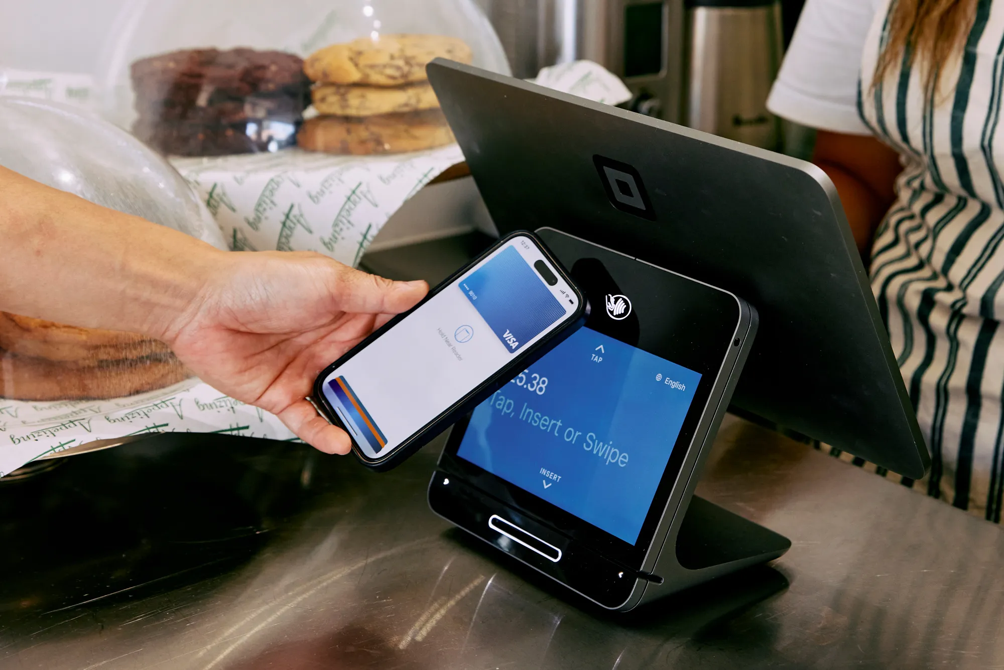 man paying with phone - Blinq Digital Business Card