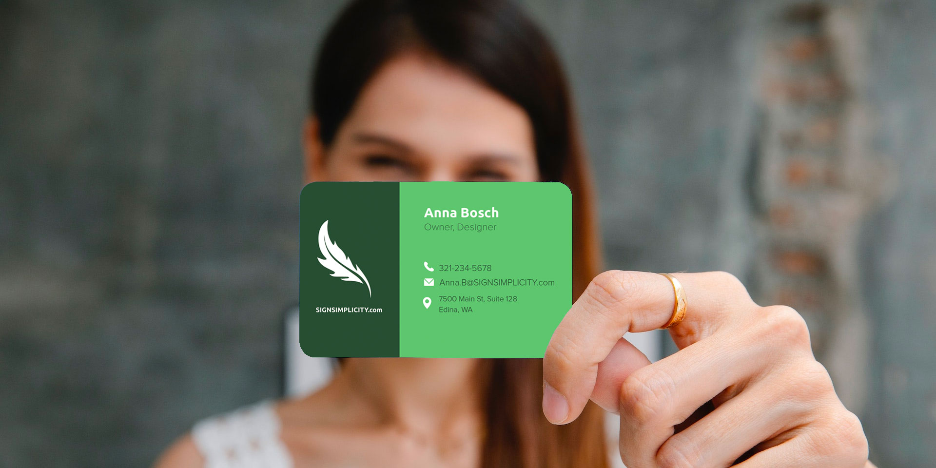 woman holding a business card - How to Make Your Business Card Stand Out