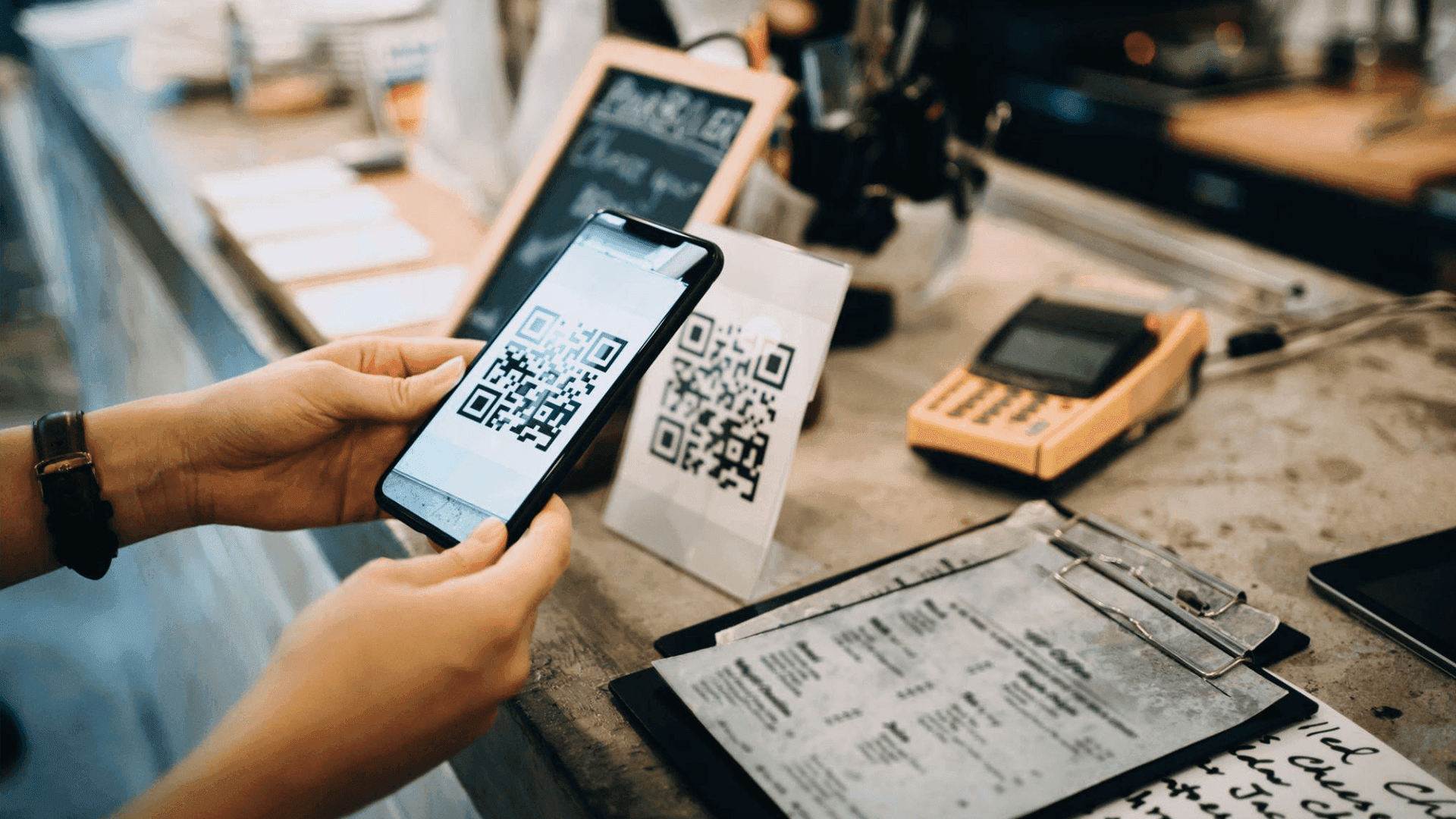 Person is scanning code for  mobile access - QR Code Marketing Strategy