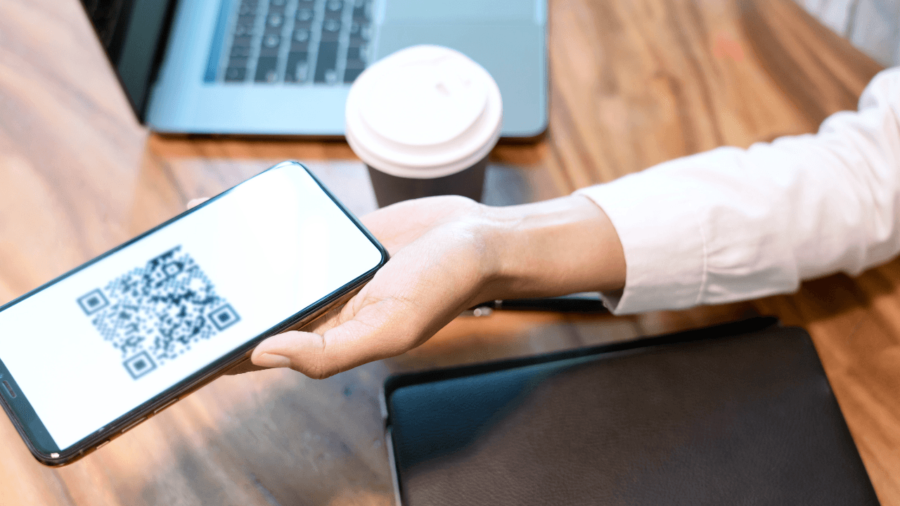 Mobile screen shows scannable pattern - QR Code Marketing Strategy