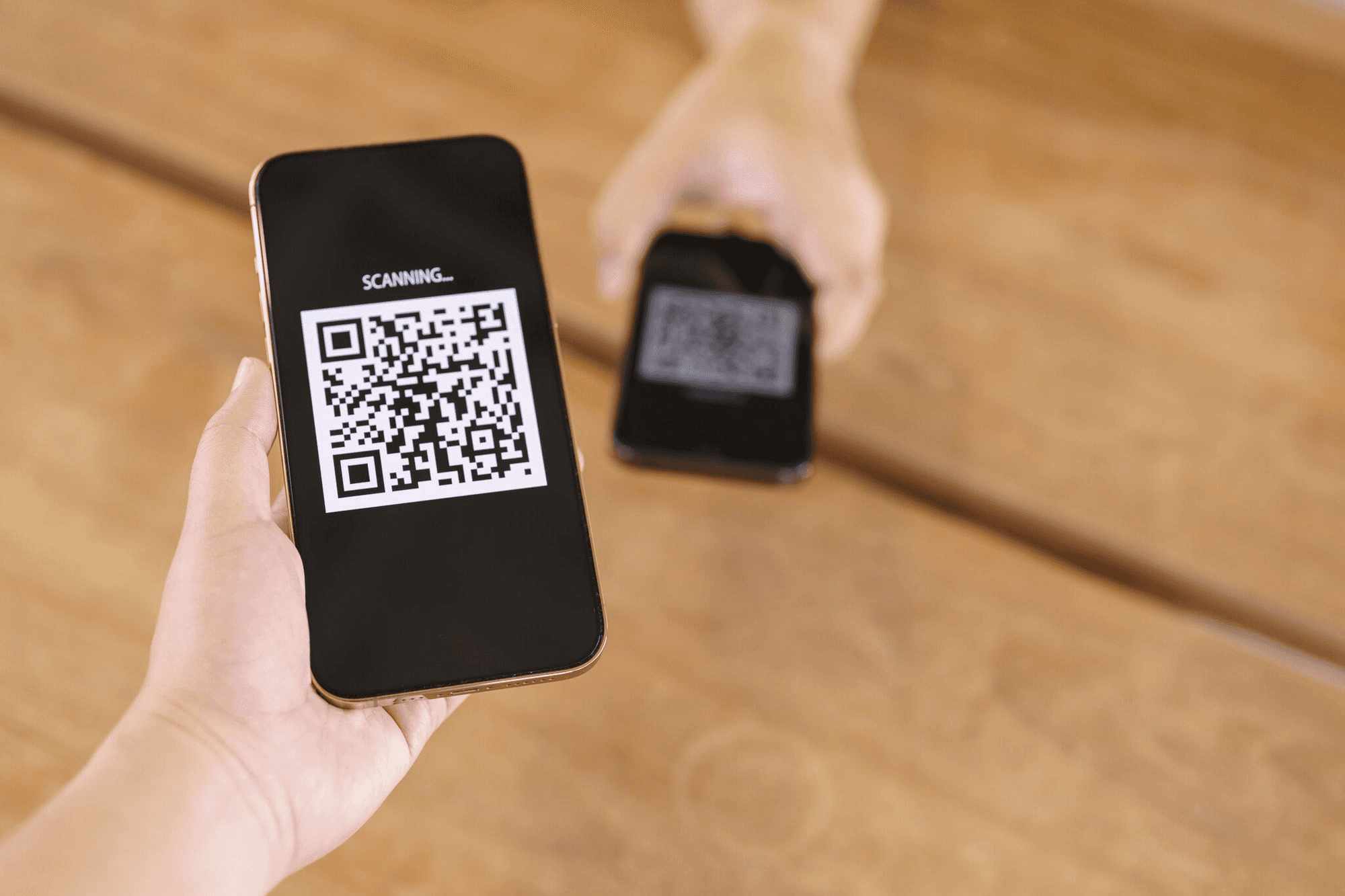 Man holding a phone - New QR Code Technology