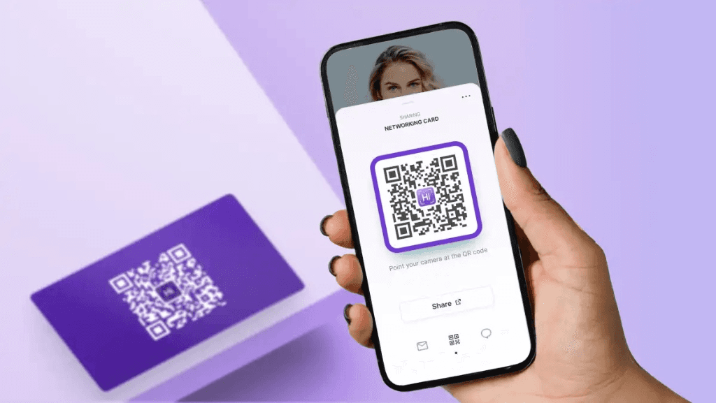 Hand holding phone displaying QR code - QR Code Instead of Business