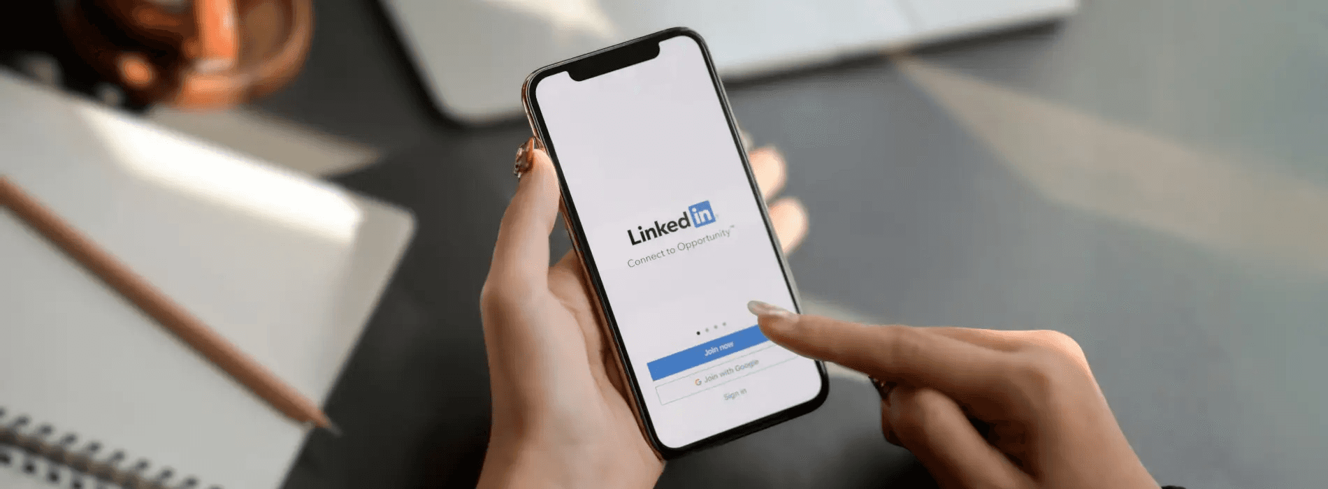 Woman using LinkedIn app - How to Add Link to LinkedIn Post