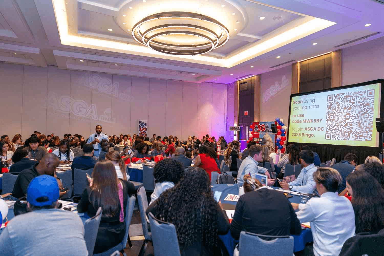Audience attending a conference presentation event -  Networking Activity Ideas for Conferences