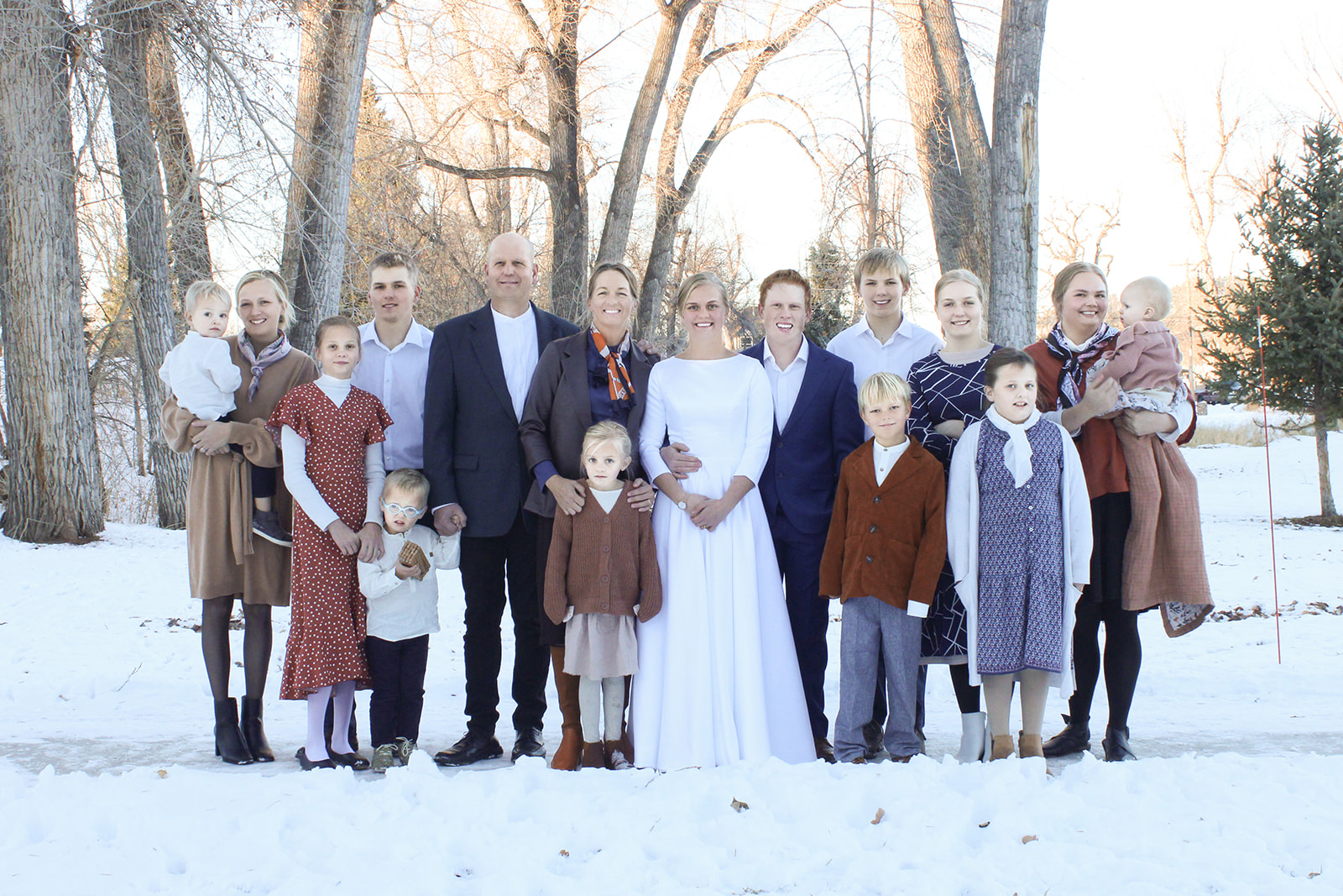 Family posing for a photo in the park