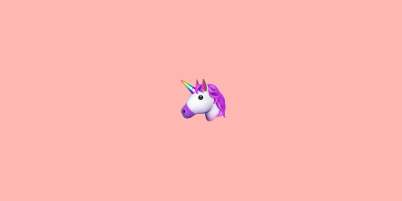 Unicorn emoji on a peach background.