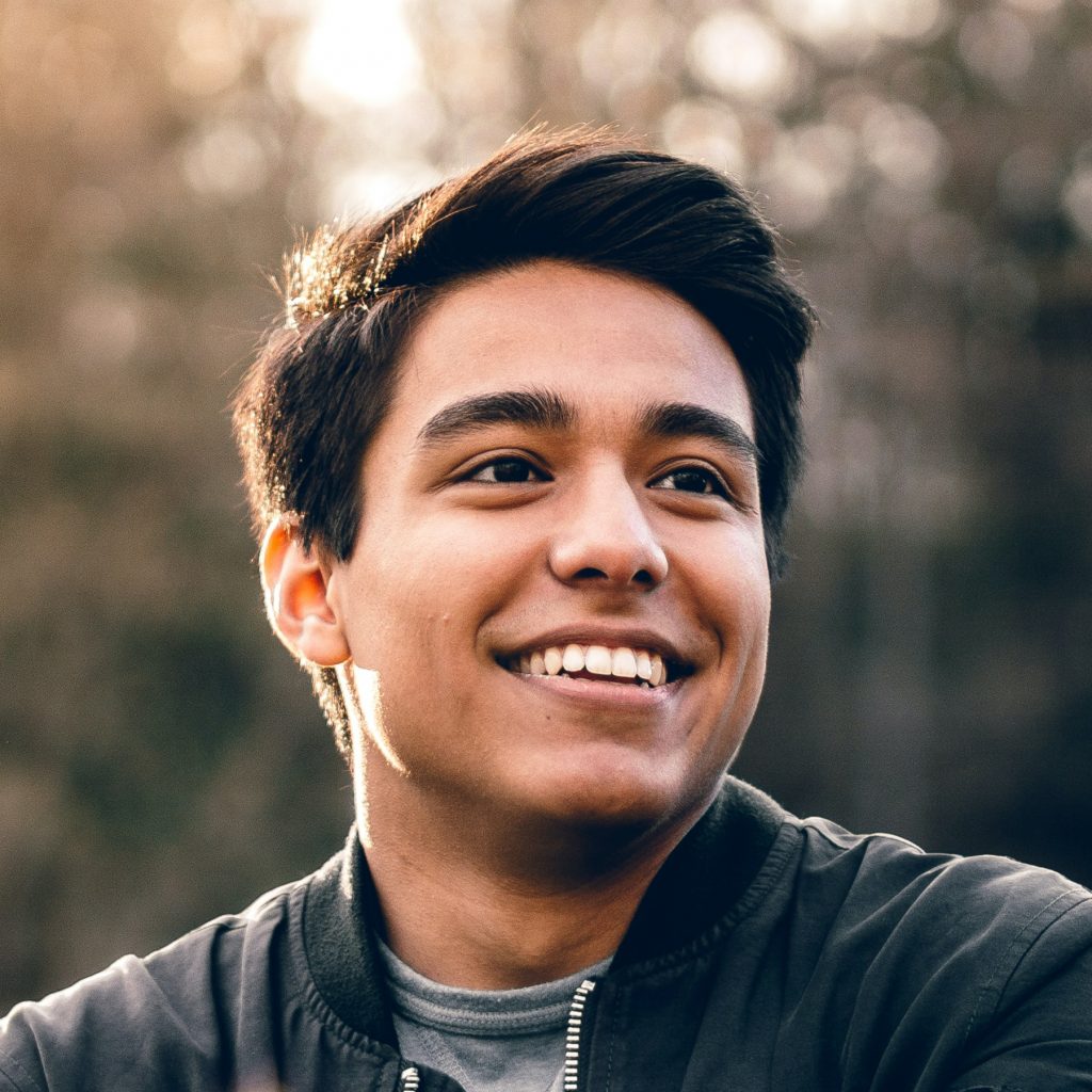 Placeholder avatar of guy smiling.