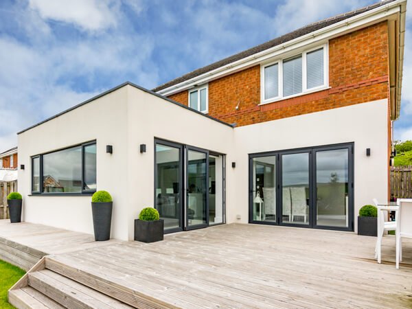 Side return extension with render finish and full glazing