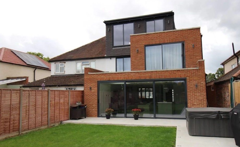 Two storey modular house extension with contemporary dark cladding